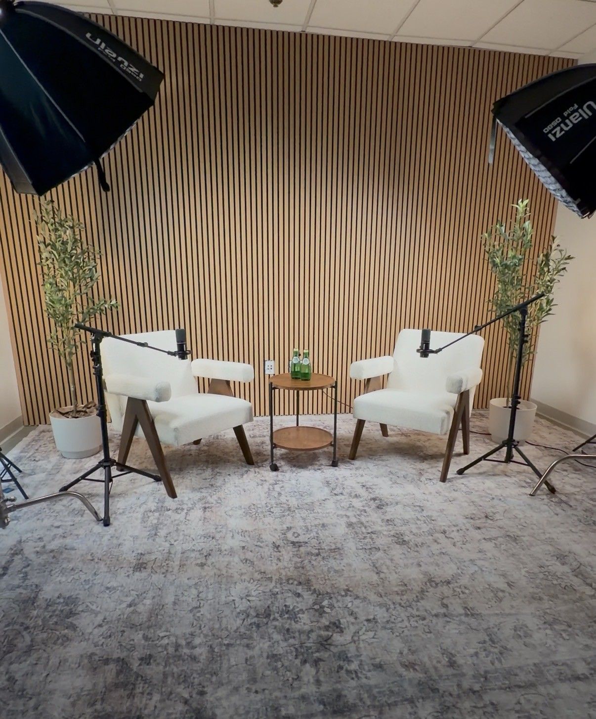 Two hexagon softbox lights above the podcast set at Axeom Content Studio